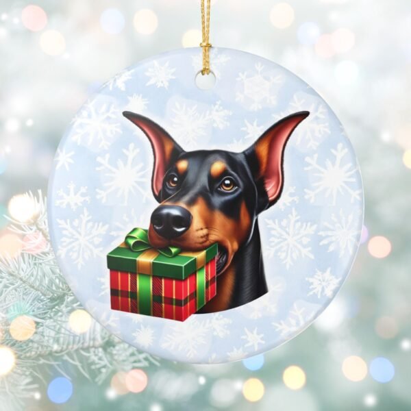Doberman Gift Giver Ceramic Ornament – Holiday Charm with Snowflake Background