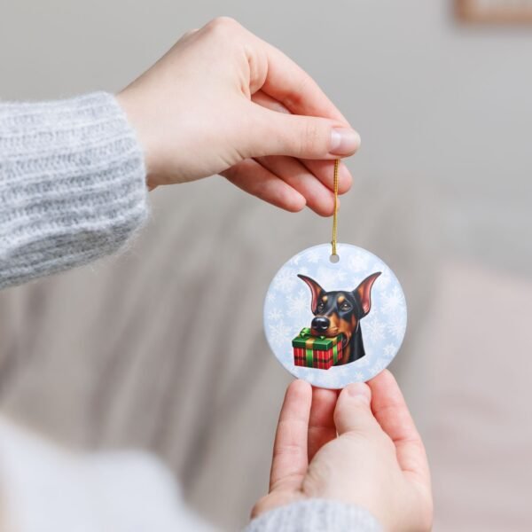 Doberman Gift Giver Ceramic Ornament – Holiday Charm with Snowflake Background - Image 4